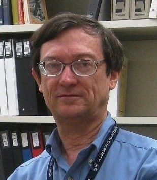 Man with glasses and brown hair.